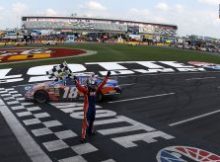 Kyle Busch salutes the fans at Charlotte Motor Speedway after winning the TECH-NET Auto Service 300 powered by CARQUEST, his fourth straight NASCAR national series victory. Credit: Streeter Lecka/Getty Images